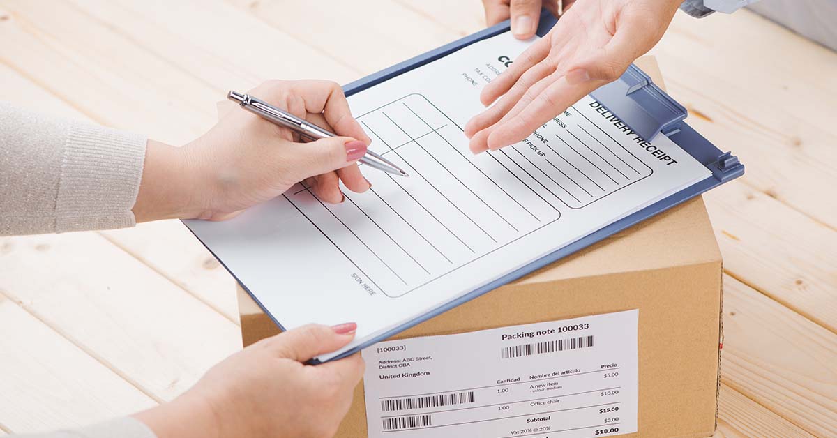 a person signing for a package