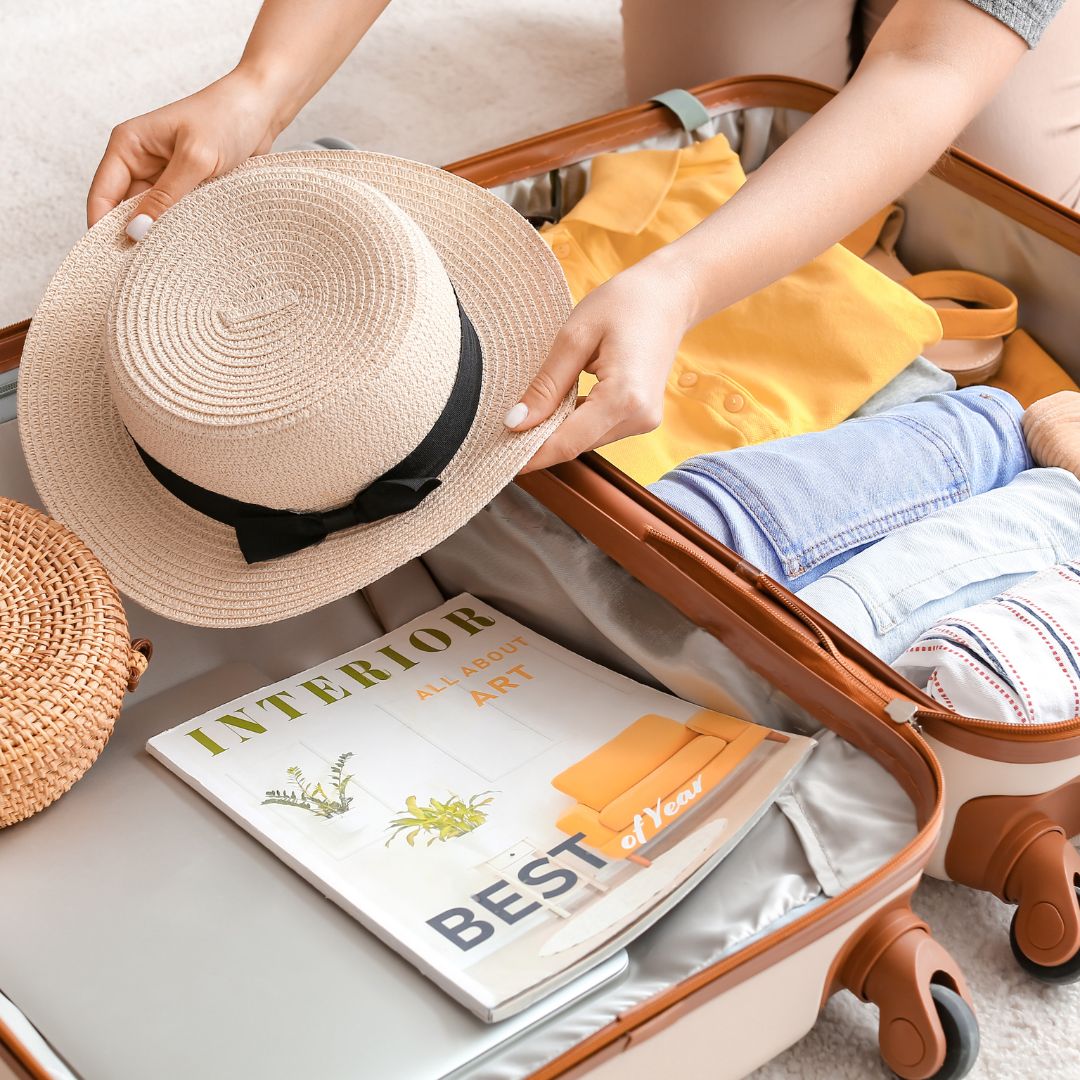 packing suitcase with room for a sunhat