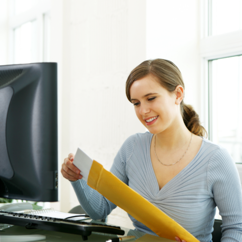 woman opening mail