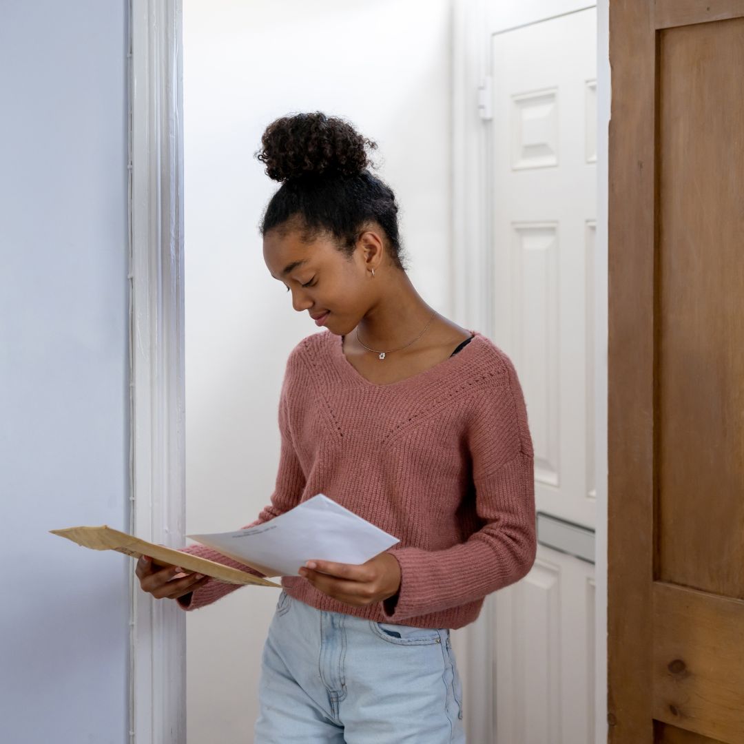 Woman opening mail.