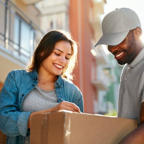 woman signing for package
