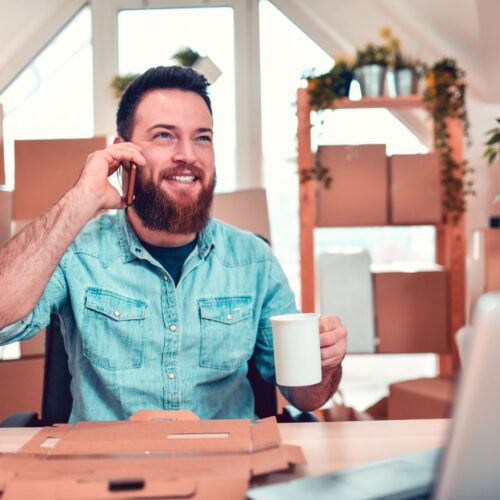 man packing boxes to ship