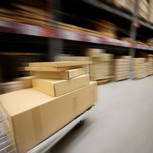 Cart of boxes moving fast