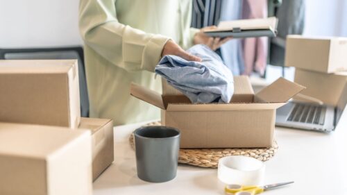 an entrepreneur person packing a box