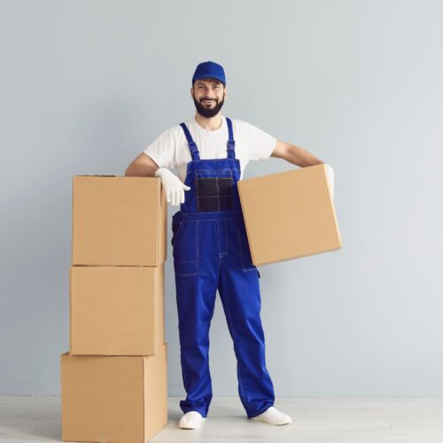 a man getting ready to ship some boxes