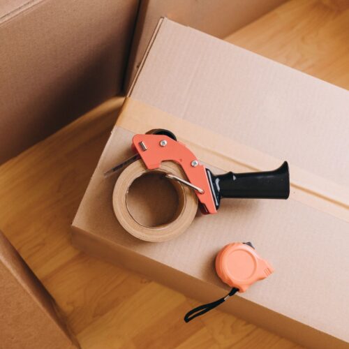 a box with a roll of packing tape on it