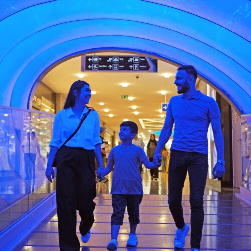 a family walking out of an airport
